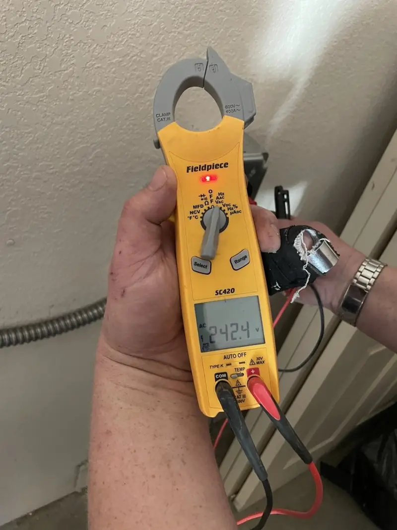 Voltage testing with clamp meter during Generator Installation in Hooper